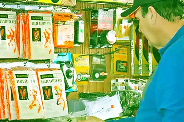 man selecting black powder supplies